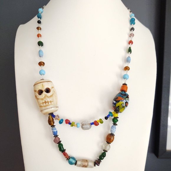 Jewelry - Unique carved stone face statement glass beaded necklace
